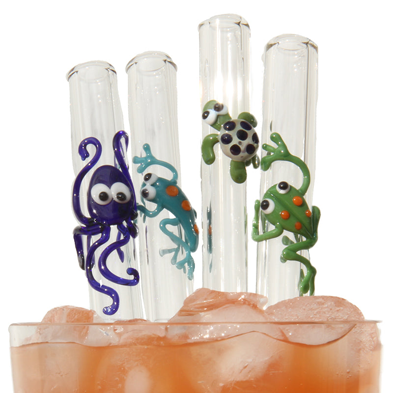 octopus, gecko, turtle and frog glass straws in a glass